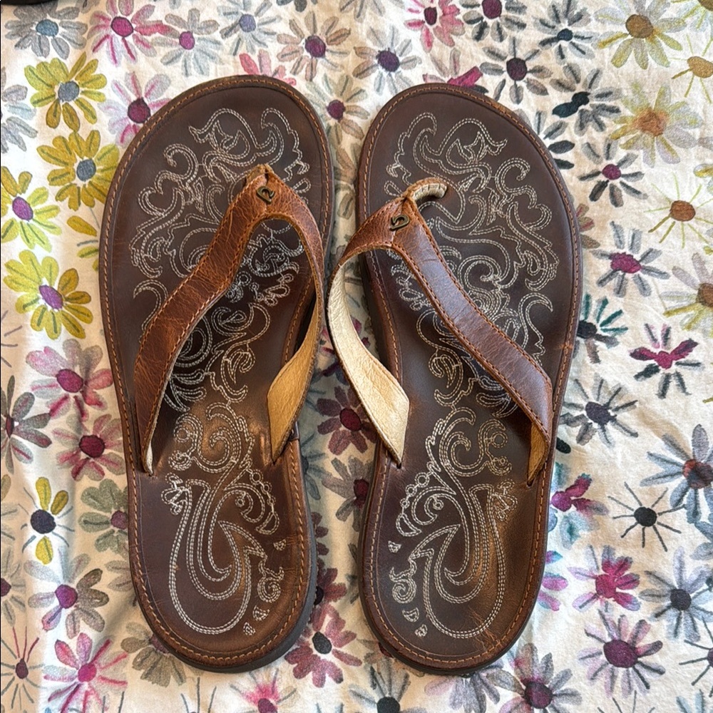 Olukai Brown Flip Flops with Paisley Design